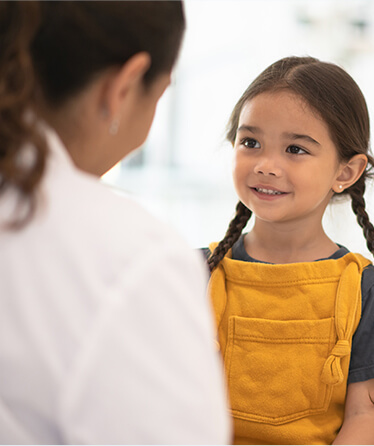 pediatrician talking to little girl